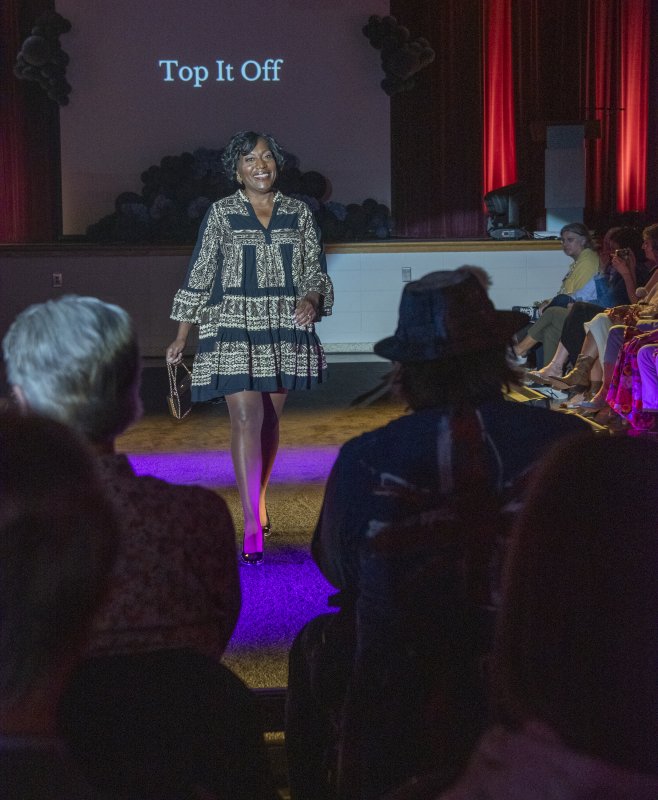 Angie Showell struts the runway in a dress from Top It Off.
